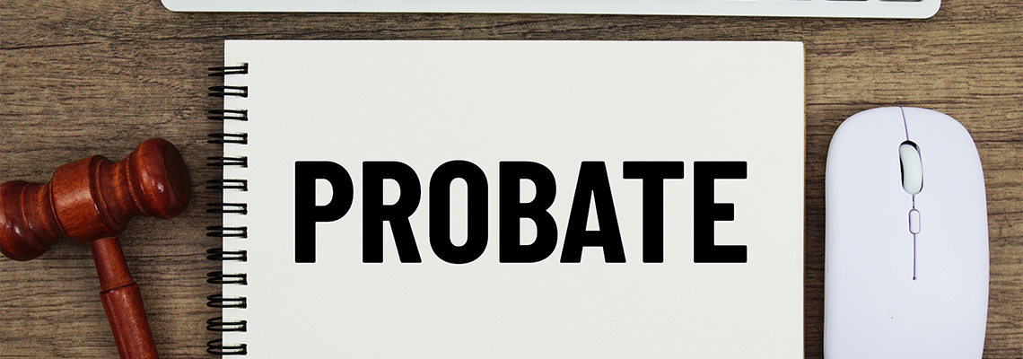 Probate text written on notepad with judge gavel, keyboard and optical mouse