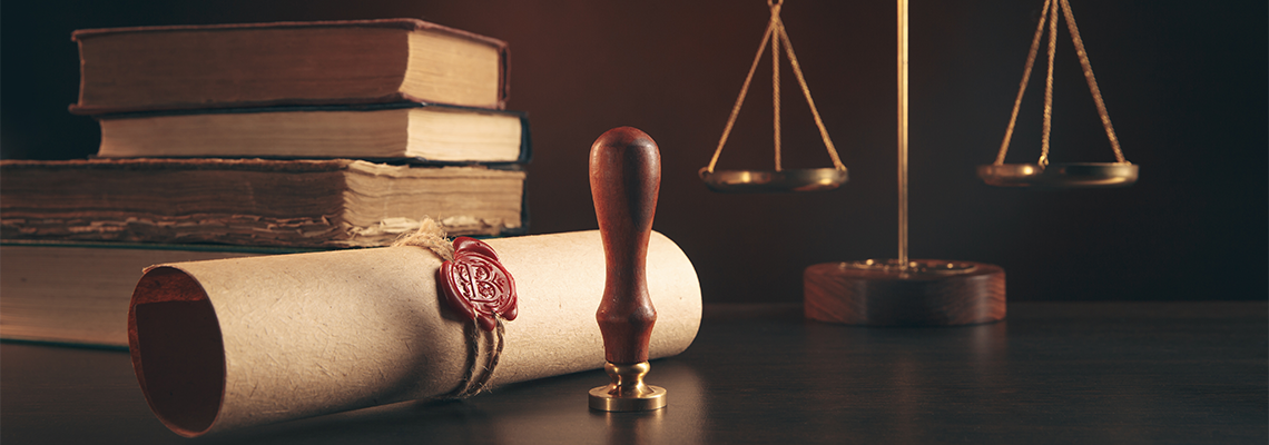 Notary's public pen and stamp on testament and last will.
