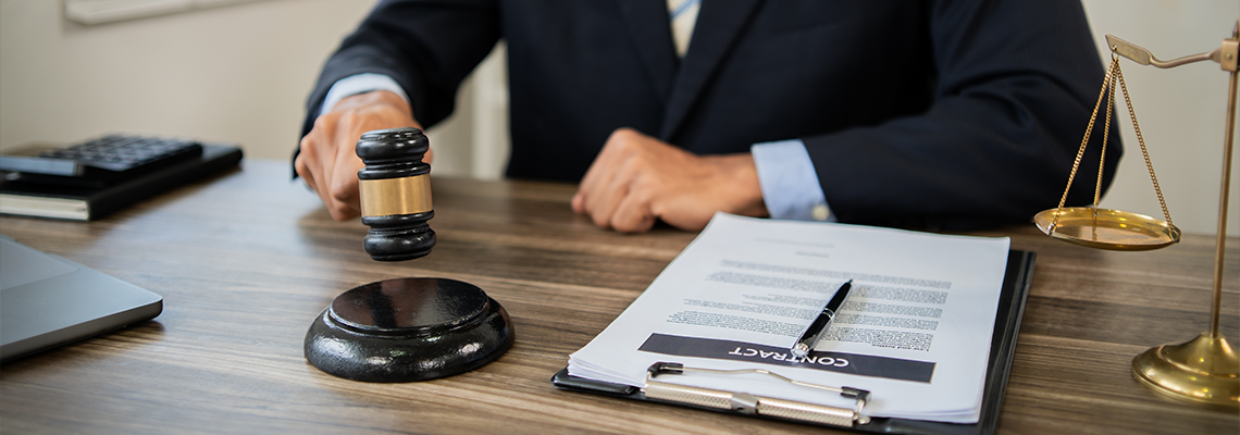 Professional lawyer advising client, reviewing legal documents