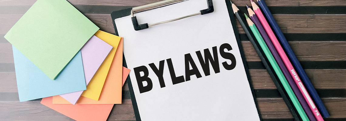 Concept of Bylaws write on paperwork isolated on wooden background