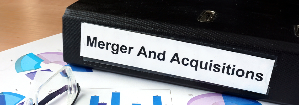 File folder with Merger and Acquisition and financial graphs