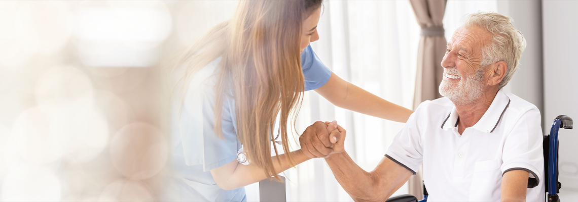 Man being cared for by a private Asian nurse at home