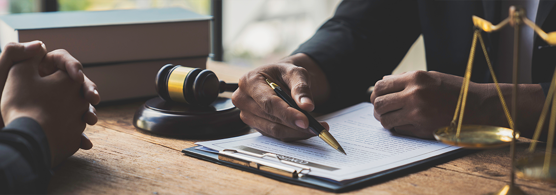 A young Asian lawyer or legal advisor clarifies information about business deals