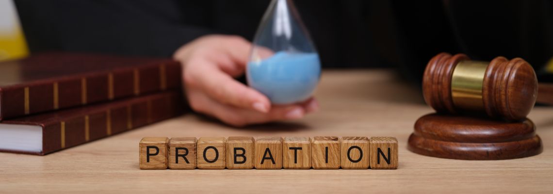 Probation word, gavel and judge holding hourglass