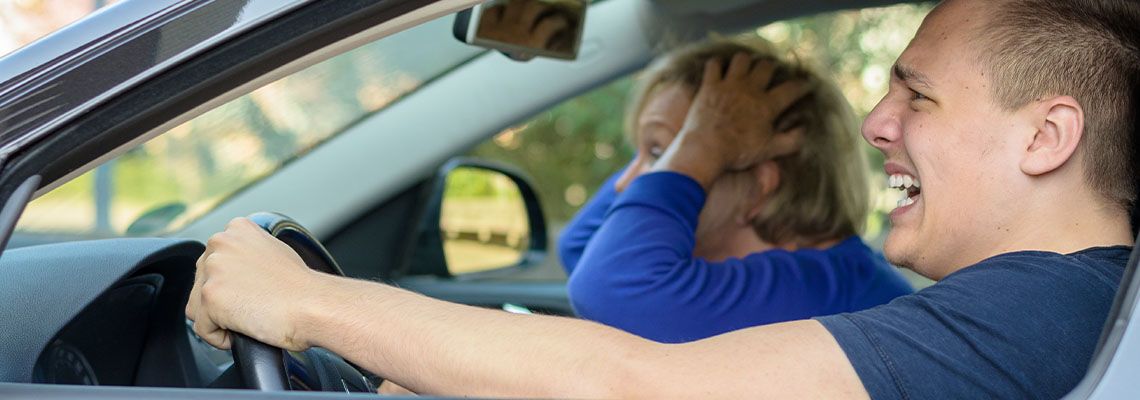 Driver and passenger bracing for car accident