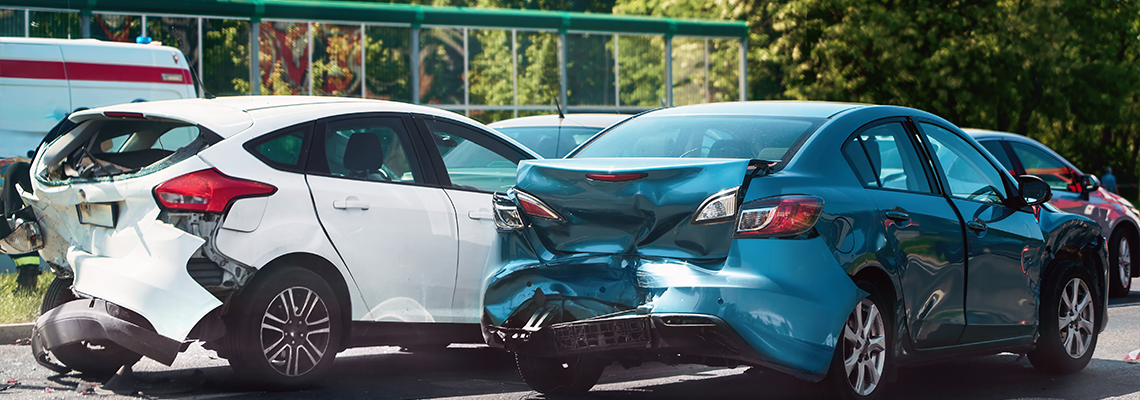 Traffic collision scene with damaged cars on roads