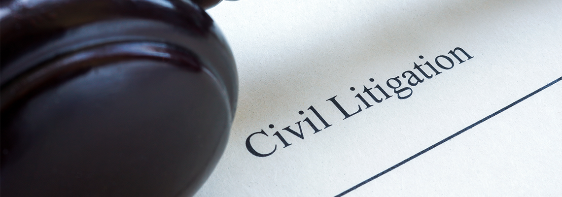 Close up of civil litigation document and gavel