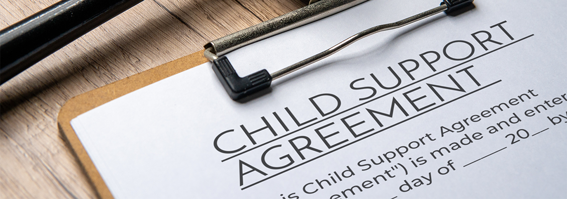 A gavel on a child support agreement document