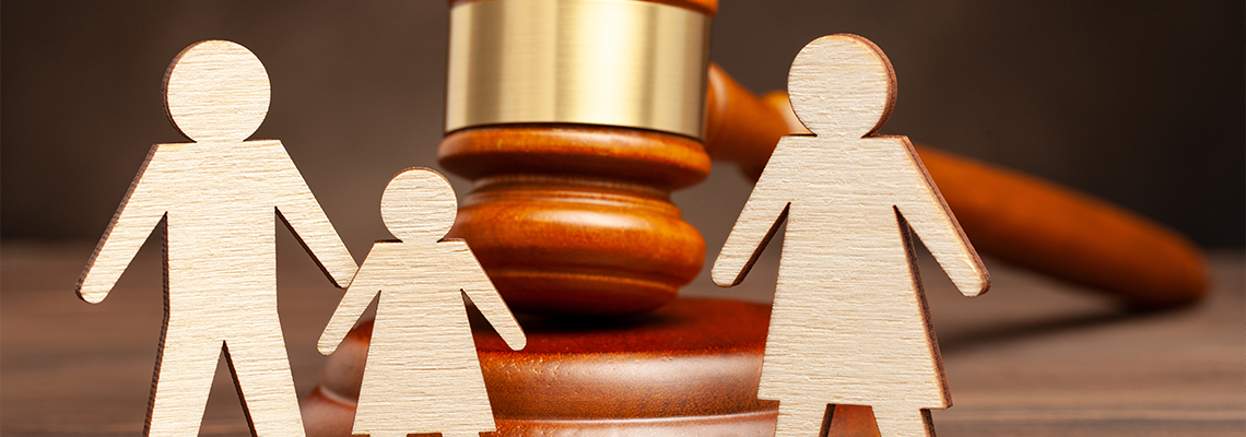 Father with child apart from mother and judge's hammer