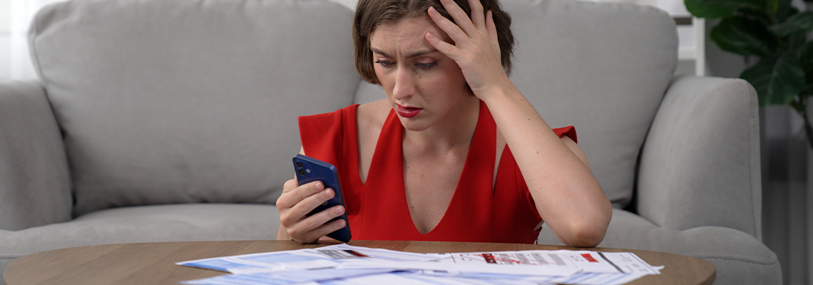 Stressed young woman has financial problems with credit card debt