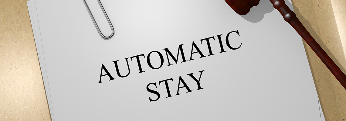 AUTOMATIC STAY on Paper and Gavel on Table