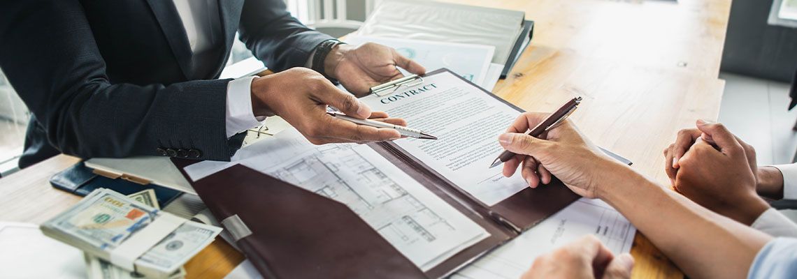 Man signing contract paper for commercial loan
