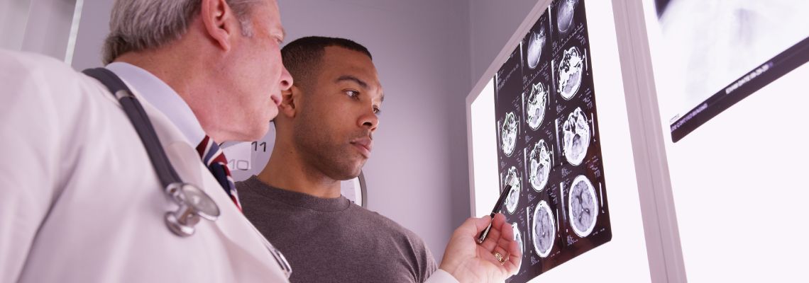 Doctor explaining brain MRI to patient
