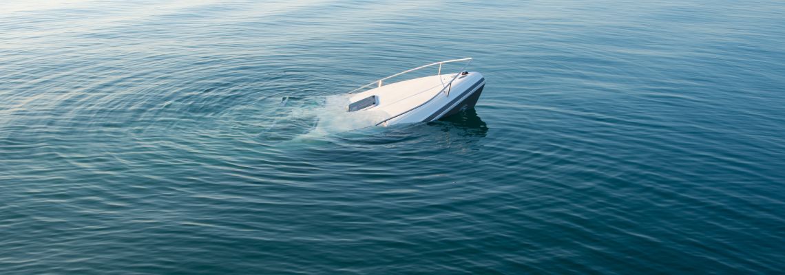 Sinking boat in sea