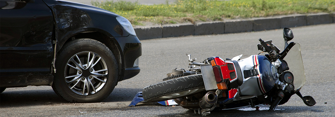 Crash moto bike and car on road