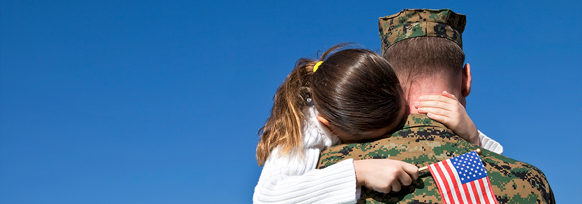 Military Father Hugging His Daughter With An American Flag