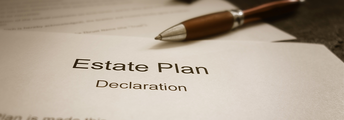 Estate Plan document with pen on the table