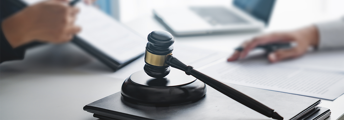 Lawyer with lawsuit meeting with client discussing with contract agreement