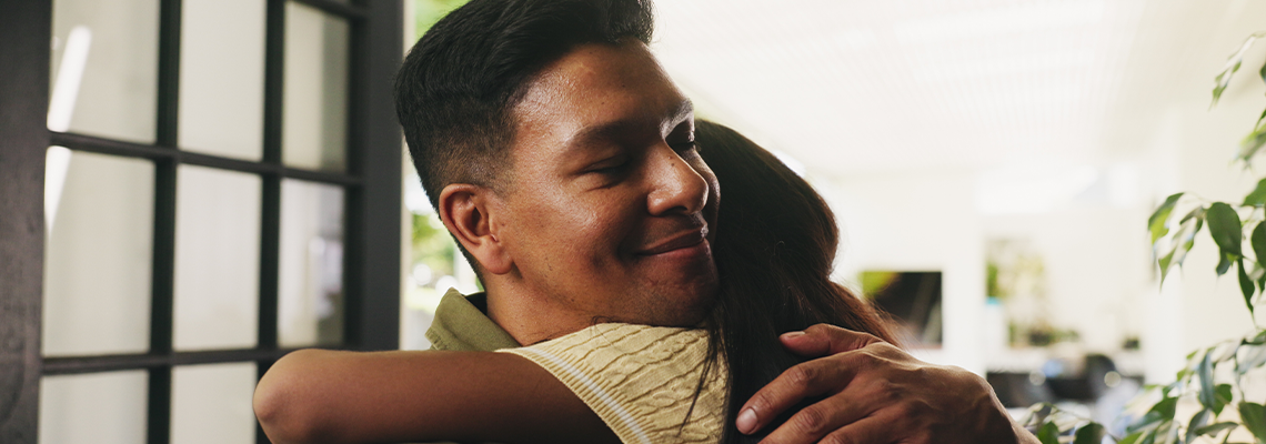 Care, father and hug kid in home for connection, trust and reunion