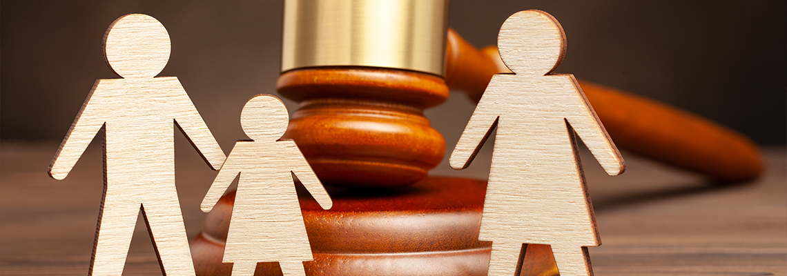 Father with child apart from mother and judge's hammer