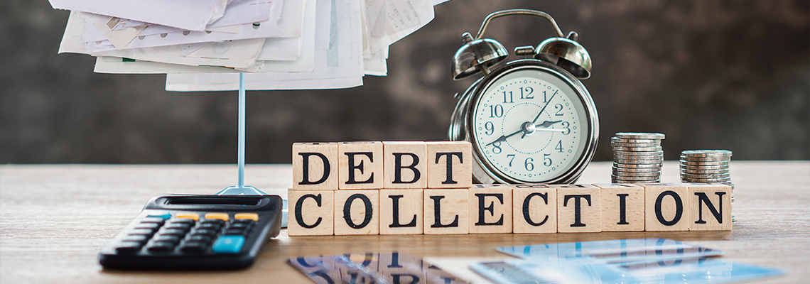 Debt collection concept with unpaid bills,calculator,coin on desk