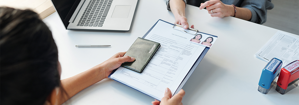 High angle view of unrecognizable woman applying for naturalization