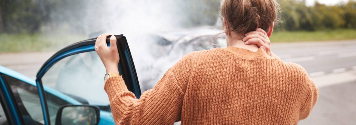 Women With Head Injury Getting Out Of Car After Crash
