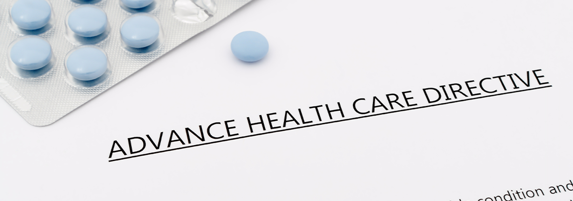 Advance health care directive with blue pills ans grey pen
