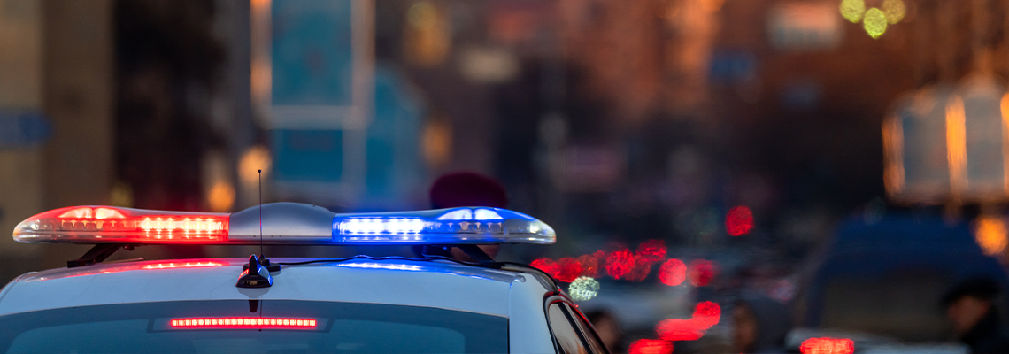 Police car in evening traffic