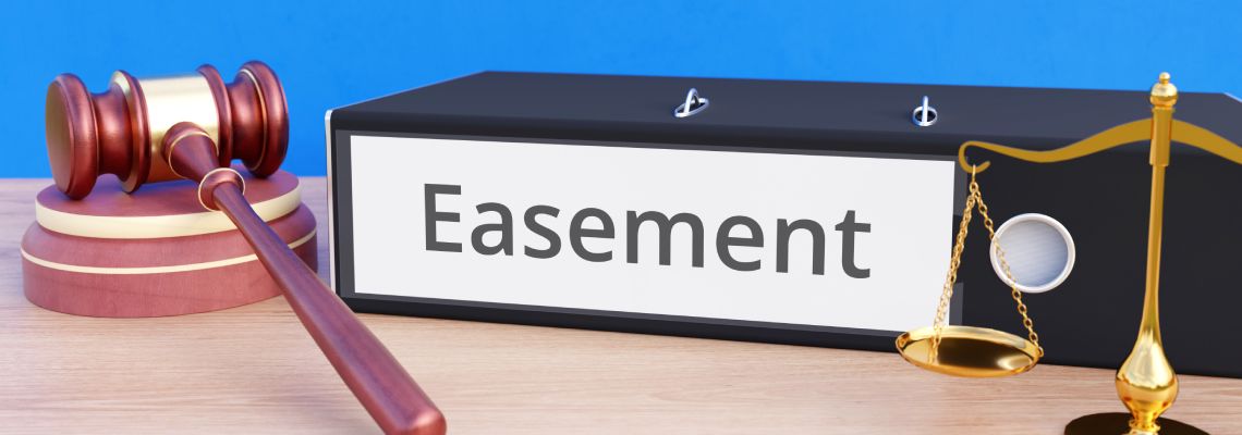 Folder with labeling Easement, gavel and scale of justice