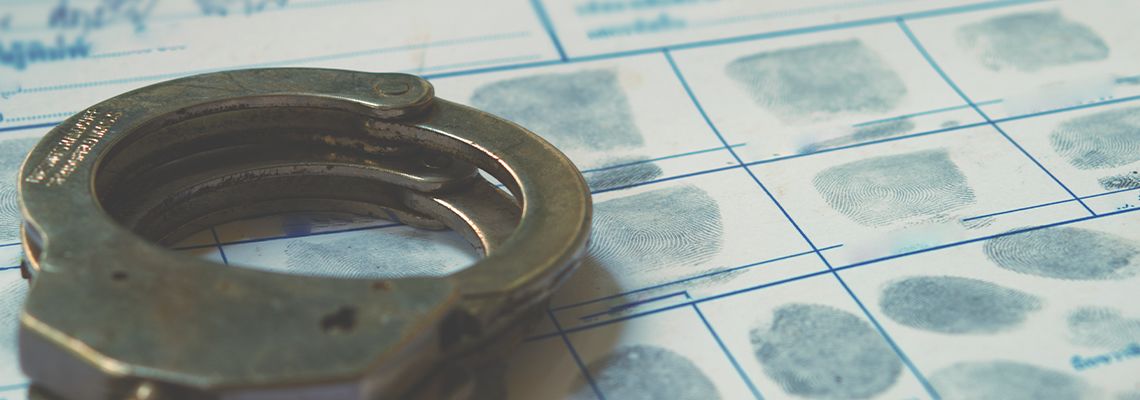 Police handcuff on fingerprint crime page file