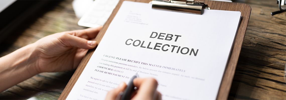 Women with pen and debt collection letter