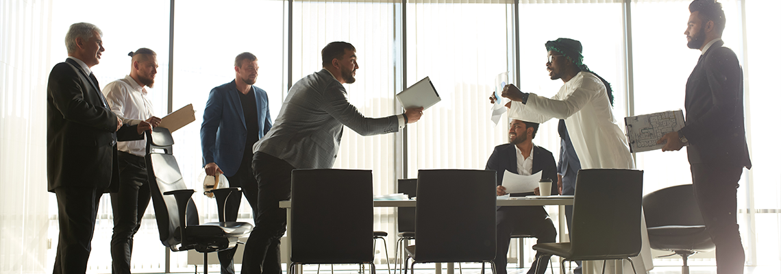 Mixed race business partners arguing about bad contract