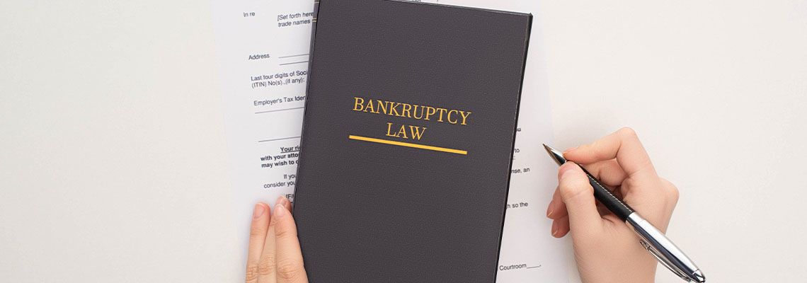 Bankruptcy Law book and Petition to file for bankruptcy in table