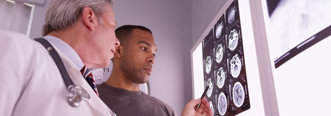 Doctor reviewing brain MRI of a patient