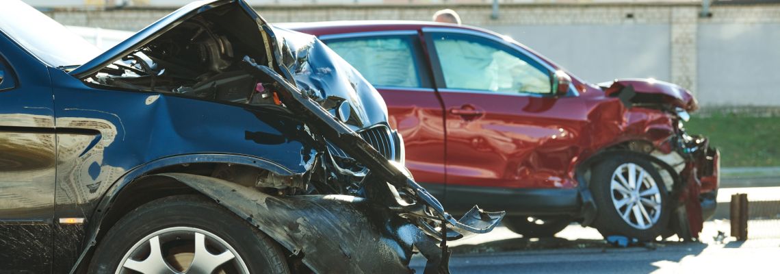 Damaged car after accident in road