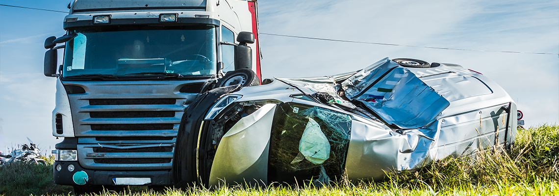 car after a collision with a heavy truck