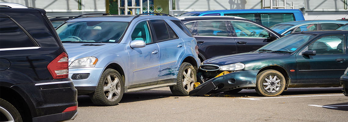 Many broken cars after a traffic accident in the parking lot of a