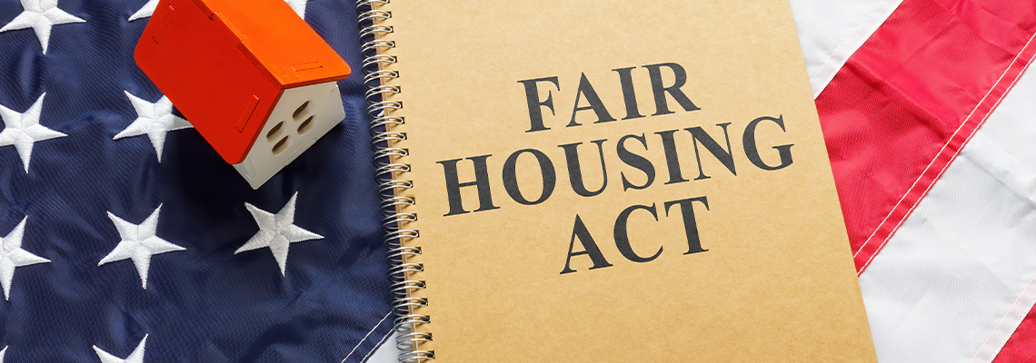 Fair housing act near tiny house on a flag