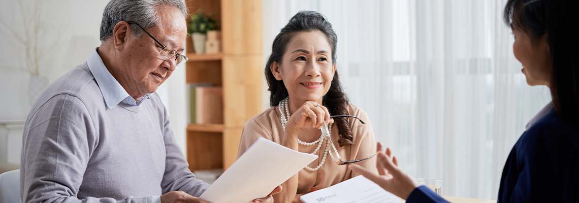 Aging couple consulting with an estate planning attorney