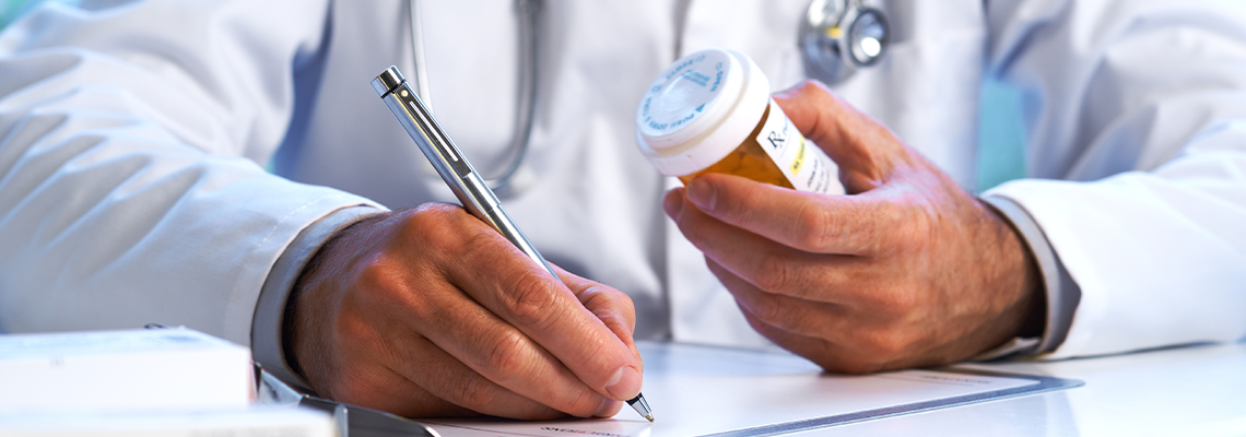 Doctor writing out RX prescription