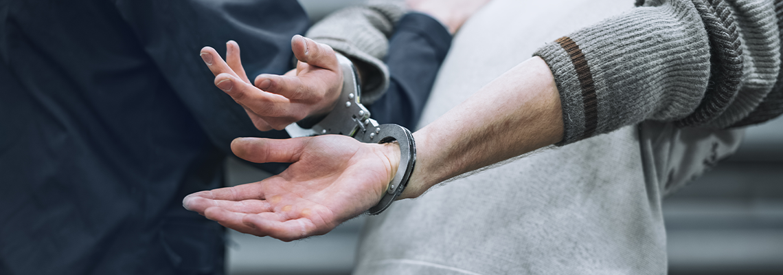 Handcuffs on the person by police