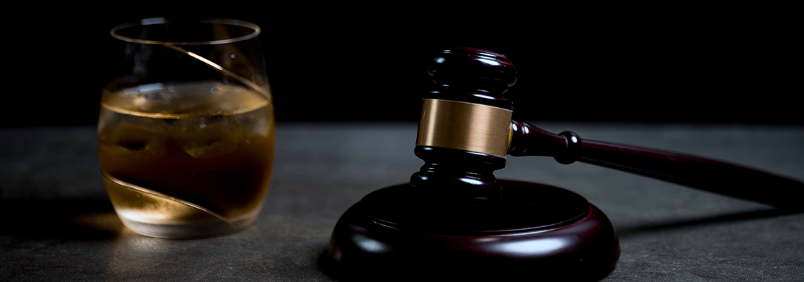 Judge's Gavel and glass of whiskey