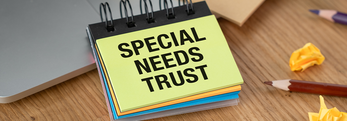 A notebook with the words Special Needs Trust written on it