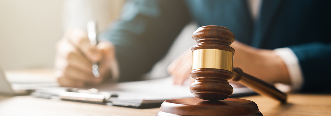 Justice concept, male judge doing report papers in courtroom, fair trial