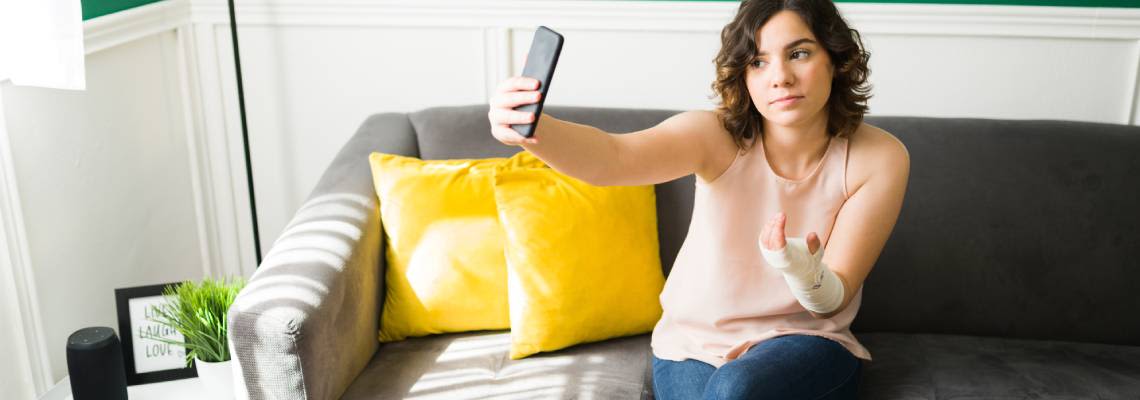 Women clicking photo of her injured hand