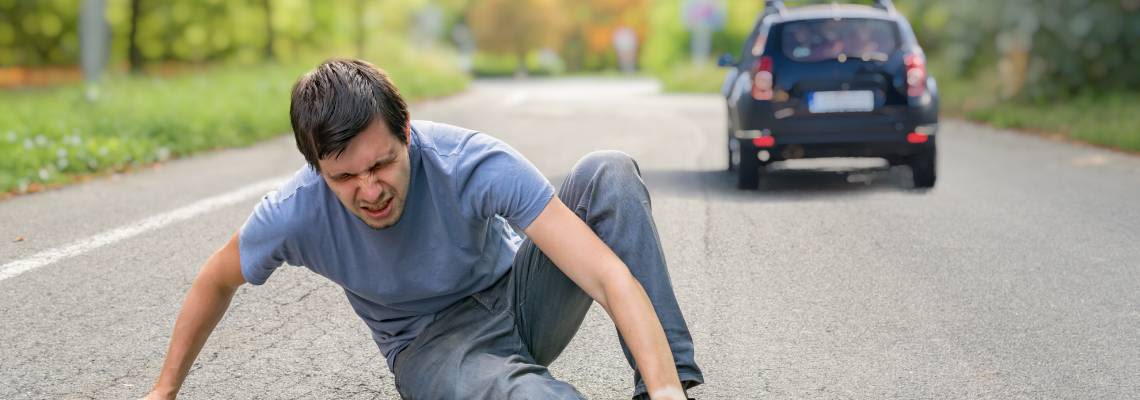 Injured man on road after hit and run accident