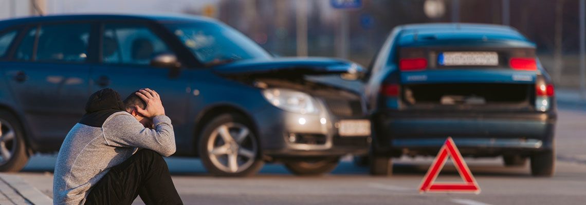 Sad man after car accident