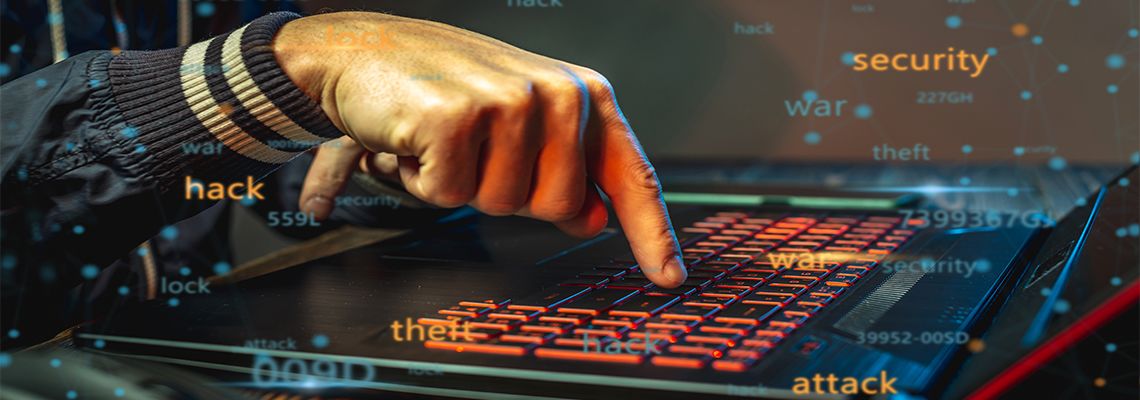 Person typing on keyboard with floating computer words