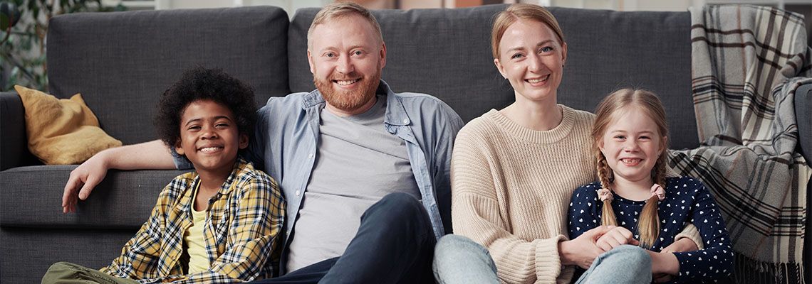 Happy family with adopted children